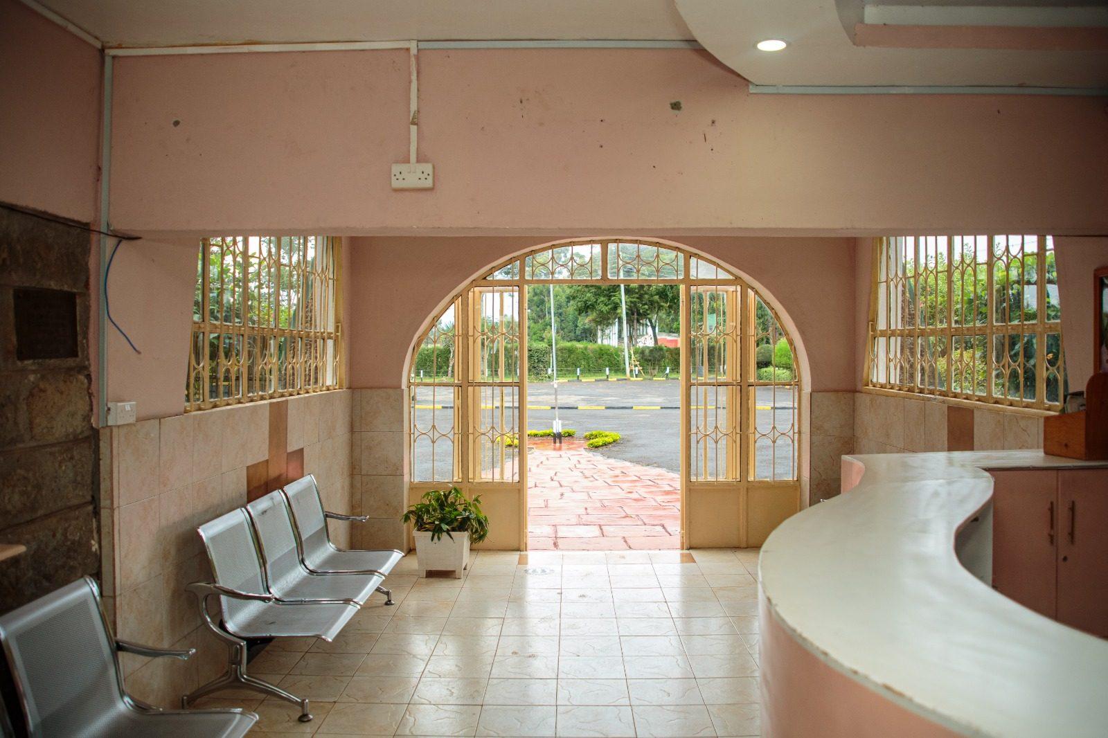 The reception hall looking out through the arched entrance to the campus road